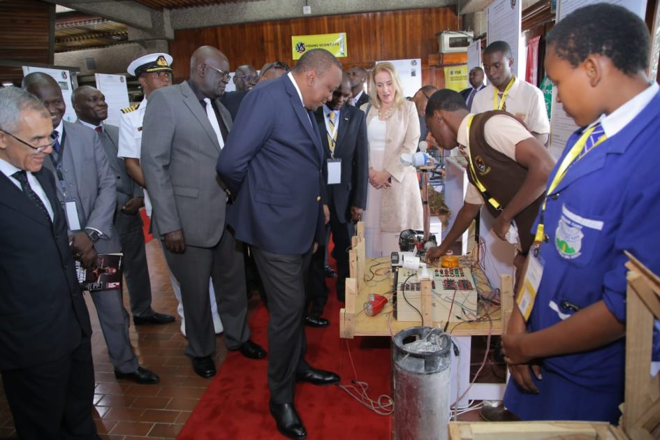 Photo- H.E President Uhuru Kenyatta (Left) looks at an innovation project by students when he opened the second Young Scientists Kenya National Science and Technology Exhibition at KICC, Nairobi, on Saturday August 3, 2019. The President encouraged the key stake holders to help commercialize these great innovations .