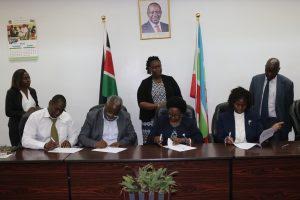 Putting pen to Paper. From left, sitting: Mr. Saronge, Eng. Mwandia, Prof. Ngumi and Prof. Abukutsa. From Left Standing: KAPS Legal Officer, Ms. Ann Buluma, Ms. Nyambura and Dr. Mwikamba