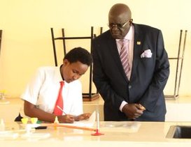 Education CS George Magoha inspects a past KCSE practical examination.