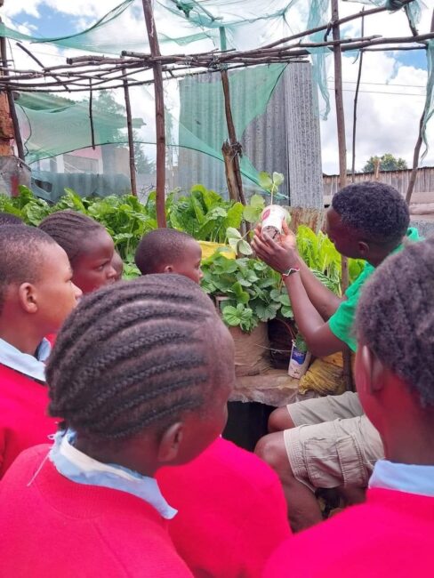 Mr Orina involving his learners in the greening project.
