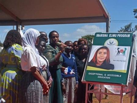 Thika area MP Alice Ng’ang’a with microphone.